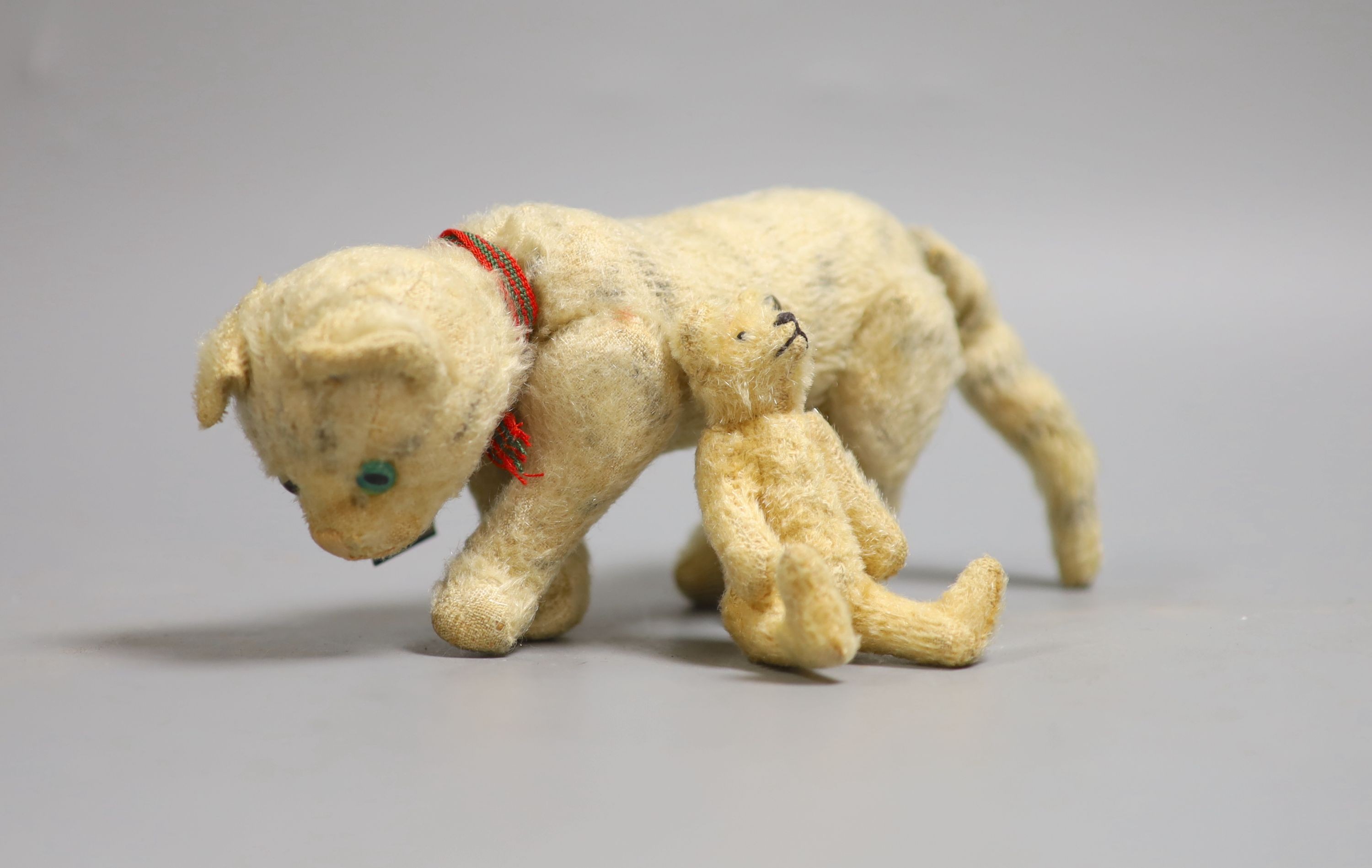 A Steiff miniature Teddy bear, 10cm high together with a cat
